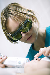 Image showing Doctor doing a fractional skin laser treatment