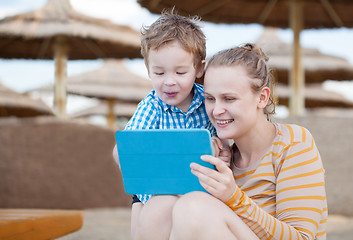 Image showing Happy mother and son at a beach resort