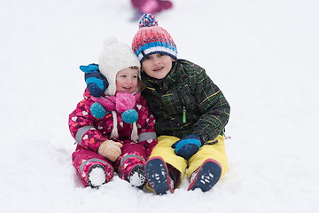 Image showing group of kids having fun and play together in fresh snow