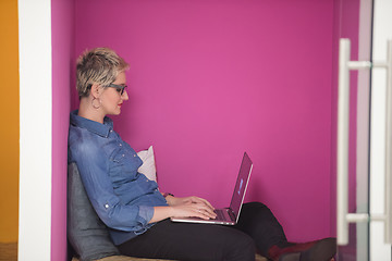 Image showing woman in crative box working on laptop