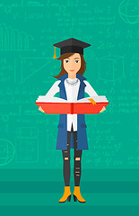 Image showing Woman in graduation cap holding book.