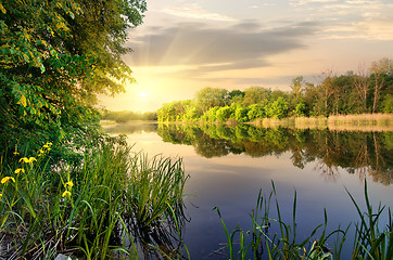 Image showing Vibrant sunset on river