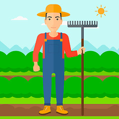 Image showing Farmer with rake.