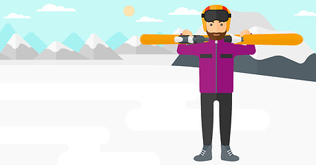 Image showing Man holding skis.