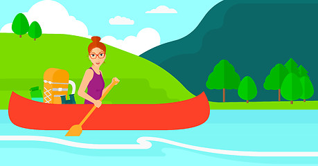 Image showing Woman canoeing on the river.