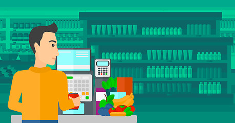 Image showing Cashier at supermarket checkout.