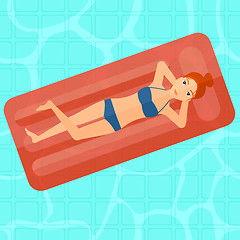 Image showing Woman relaxing in swimming pool.