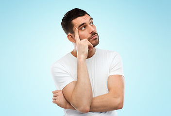 Image showing man thinking over blue background
