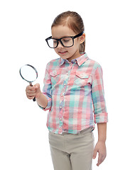 Image showing little girl in eyeglasses with magnifying glass