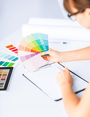 Image showing woman working with color samples for selection