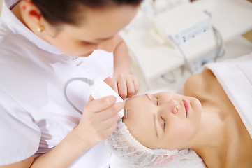 Image showing Ultrasonic face cleaning at the beauty spa