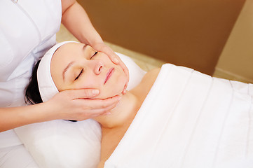 Image showing Woman taking facial treatments at beauty spa