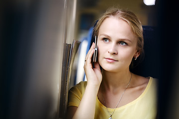 Image showing Woman listening to a call on her mobile