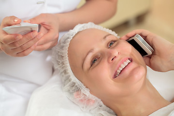 Image showing Woman having a phone talk at beauty spa