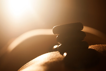 Image showing Girl taking hot stone treatments at beauty spa