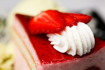 Image showing Whirl of whipped cream topping on a cake