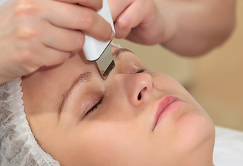 Image showing Woman under procedure of ultrasonic facial cleaning