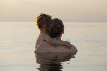 Image showing Mother and son watching the sunset