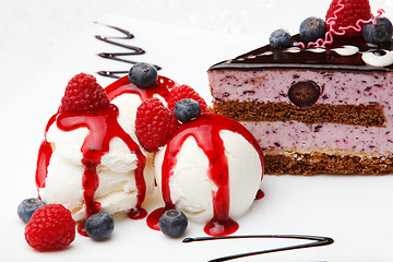 Image showing Vanilla icecream with berry coulis and fresh fruit