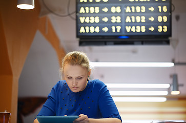 Image showing Woman with touchpad in the waiting room