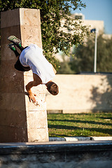 Image showing Young man performing parkour in the city