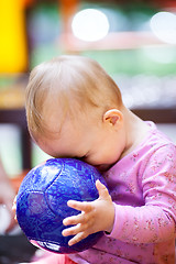 Image showing Cute little baby playing with a ball