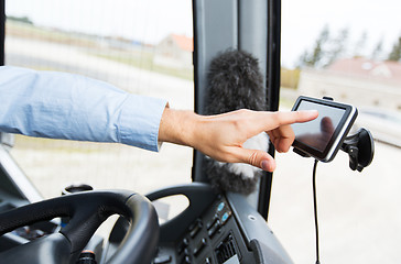 Image showing close up of bus driver driving with gps navigator