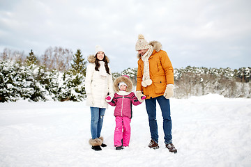 Image showing happy family with child in winter clothes outdoors