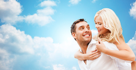 Image showing happy couple over blue sky