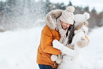 Image showing happy couple hugging and laughing in winter