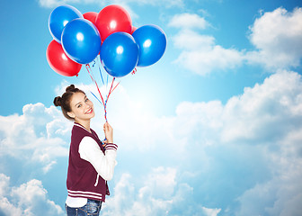 Image showing happy teenage girl with helium balloons