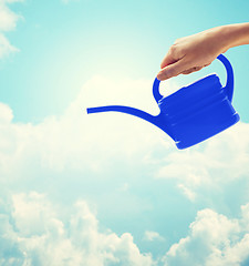 Image showing close up of woman hand holding watering can