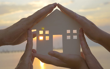 Image showing Hands on cut out house diagram