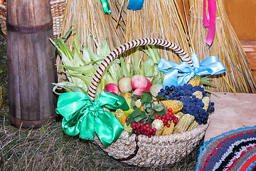 Image showing Fruits and vegetables in wicker basket sold at the fair.