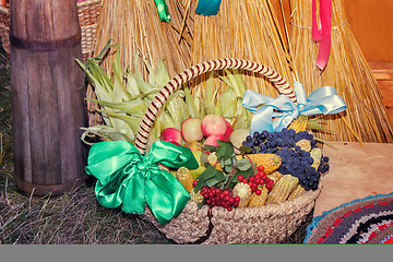 Image showing Fruits and vegetables in wicker basket sold at the fair.