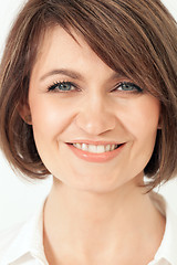 Image showing Headshot of adult woman with toothy smile.