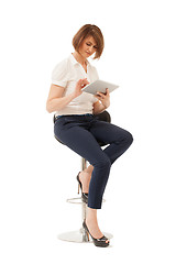 Image showing Businesswoman using tablet while sitting on chair