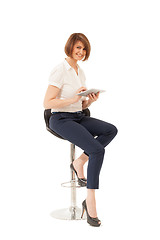 Image showing Elegant smiling woman holding tablet