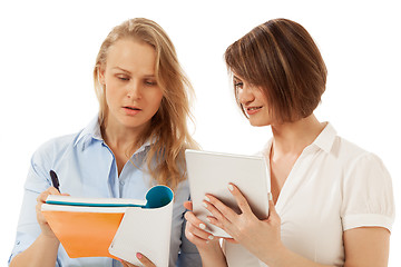 Image showing Woman showing something in her folder to colleague