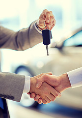 Image showing close up of handshake in auto show or salon