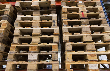 Image showing wooden cargo pallets storing at warehouse shelves