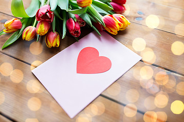 Image showing close up of flowers and greeting card with heart