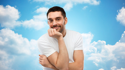 Image showing smiling man over blue sky