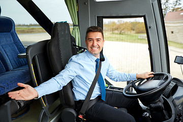 Image showing happy driver inviting on board of intercity bus