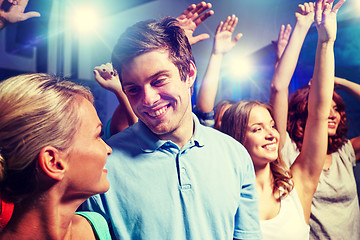 Image showing smiling friends at concert in club