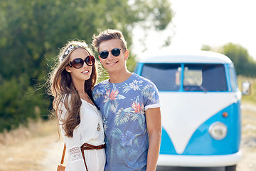 Image showing smiling young hippie couple over minivan car