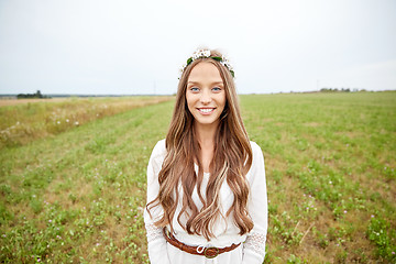 Image showing smiling young hippie woman on cereal field