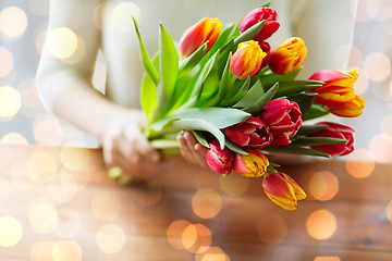 Image showing close up of woman holding tulip flowers