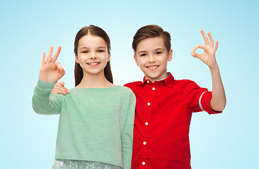 Image showing happy boy and girl showing ok hand sign