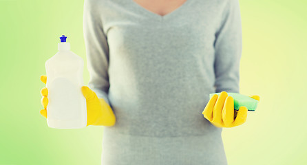 Image showing close up of woman with sponge and cleanser